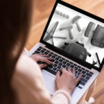 Watching assembly of ergohuman chair on laptop
